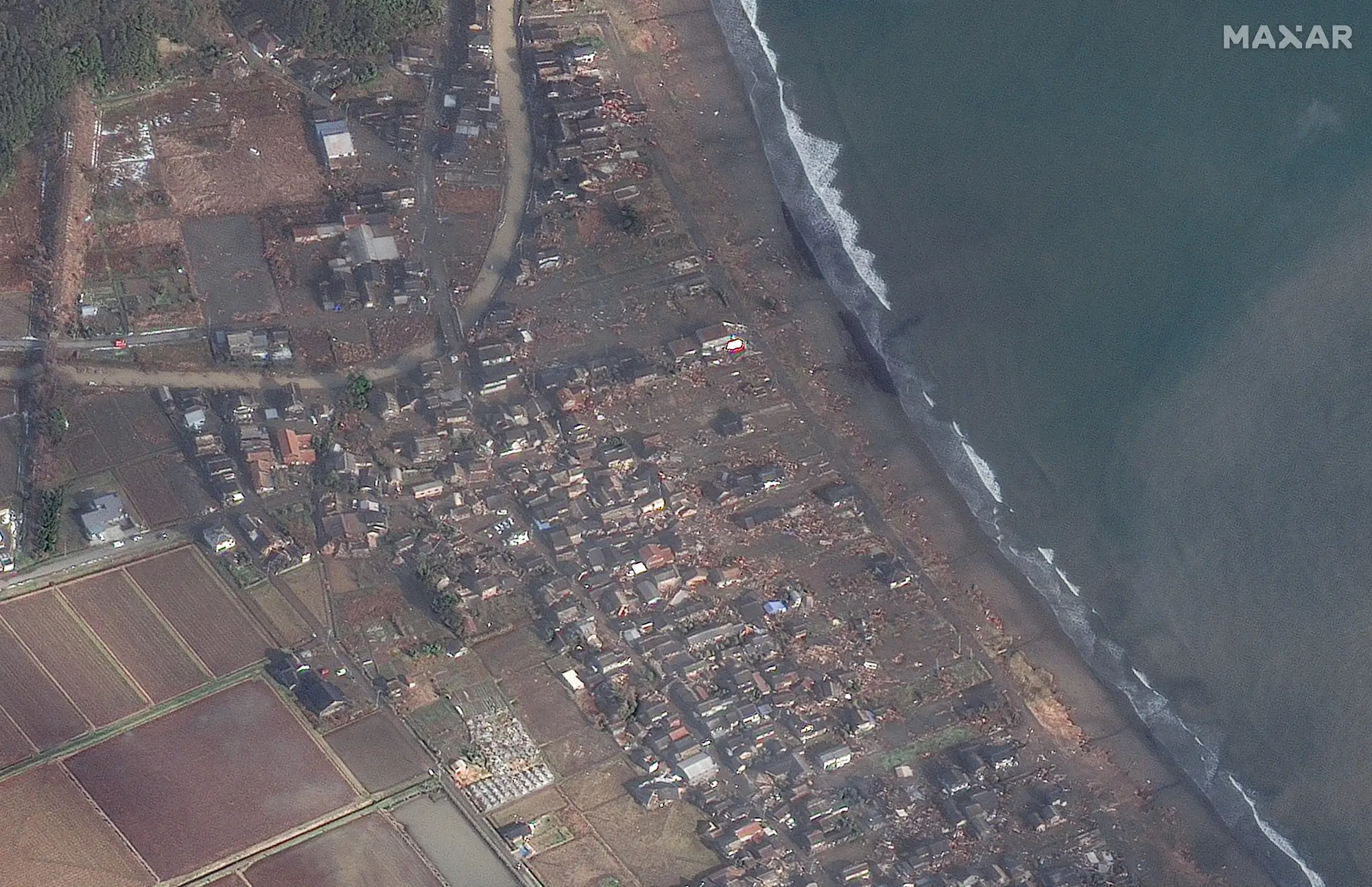 Coastline near Ukai Japan after a powerful earthquake. Dozens of destroyed homes along the coast are shown.